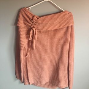 This is a beautiful warm peach sweater